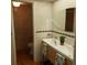 Bathroom featuring double sinks and an oval mirror above the vanity at 113 Nina Way # 113, Oldsmar, FL 34677