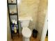Bathroom featuring a toilet with a storage shelf and tiled walls at 113 Nina Way # 113, Oldsmar, FL 34677