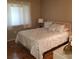 Cozy bedroom with a patterned bedspread and a neutral color palette at 113 Nina Way # 113, Oldsmar, FL 34677