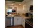 Kitchen featuring stainless steel appliances, granite counters and white cabinets at 113 Nina Way # 113, Oldsmar, FL 34677