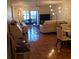 Inviting living room featuring tile flooring, a ceiling fan, and comfortable seating with lanai access at 113 Nina Way # 113, Oldsmar, FL 34677