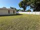 Spacious backyard with a privacy fence, offering a secure and private outdoor area at 11708 Nicklaus Cir, Tampa, FL 33624