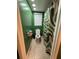 View of the bathroom showcasing a toilet and a modern shower curtain at 11708 Nicklaus Cir, Tampa, FL 33624