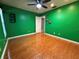 Large bedroom featuring hardwood floors and ceiling fan at 11708 Nicklaus Cir, Tampa, FL 33624