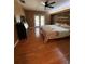 Bedroom featuring hardwood floors and a door that leads to the outside at 11708 Nicklaus Cir, Tampa, FL 33624