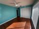 Bright bedroom featuring hardwood floors and a closet at 11708 Nicklaus Cir, Tampa, FL 33624