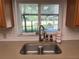 Kitchen sink beneath a window overlooking a screened-in patio and fenced yard at 11708 Nicklaus Cir, Tampa, FL 33624