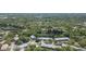 Aerial shot of the community showcasing lush landscaping, a tranquil lake, and well-maintained buildings at 11868 Skylake Pl # 11767, Temple Terrace, FL 33617