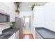 The kitchen offers gray cabinets, stainless steel appliances and a view of the washer and dryer at 11868 Skylake Pl # 11767, Temple Terrace, FL 33617
