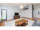 Inviting living room with open design, wood flooring, and plenty of natural light at 11868 Skylake Pl # 11767, Temple Terrace, FL 33617