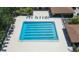 Aerial view of a rectangular community pool with marked lanes and surrounding lounge chairs at 11868 Skylake Pl # 11767, Temple Terrace, FL 33617