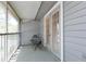 An enclosed back porch features a table and chairs with a view of the outdoors at 11868 Skylake Pl # 11767, Temple Terrace, FL 33617