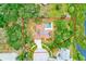 Aerial view of property boundaries including a private pool, solar panels and lake access at 12302 Knight Pl, Thonotosassa, FL 33592