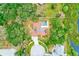 Aerial view of a well-situated home with a private pool, and possible solar panels at 12302 Knight Pl, Thonotosassa, FL 33592