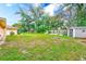 The spacious backyard includes a shed and a sunny lawn area at 12302 Knight Pl, Thonotosassa, FL 33592