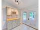 Stylish bar area features wood countertop, wine rack, and direct access to outdoor pool area at 12302 Knight Pl, Thonotosassa, FL 33592