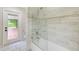 Bathroom featuring bathtub and shower with modern tile work at 12302 Knight Pl, Thonotosassa, FL 33592