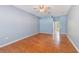 Spacious bedroom with hardwood floors, ensuite bathroom, and ample natural light at 12302 Knight Pl, Thonotosassa, FL 33592