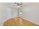 Bedroom featuring hardwood floors, a window, and a closet door at 12302 Knight Pl, Thonotosassa, FL 33592