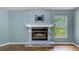 Living room fireplace features stone facade and white mantle with a mounted tv bracket above at 12302 Knight Pl, Thonotosassa, FL 33592