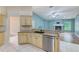 The kitchen features granite countertops, tiled floors, and stainless steel appliances at 12302 Knight Pl, Thonotosassa, FL 33592