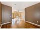 Open living area with hardwood floors, neutral walls and a view of the foyer at 12302 Knight Pl, Thonotosassa, FL 33592