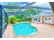 Enjoy the Florida lifestyle with this in-ground pool, screened enclosure, and brick-paved patio at 12302 Knight Pl, Thonotosassa, FL 33592