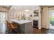 Bright kitchen with a wine fridge, white cabinets, and stainless steel appliances at 12944 98Th St, Largo, FL 33773