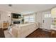 Inviting living room with fireplace, dark wood floors and lots of natural light at 12944 98Th St, Largo, FL 33773