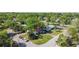 Charming single-Gathering home with lush landscaping, mature trees, and a spacious yard on a corner lot at 1411 Barry St, Clearwater, FL 33756