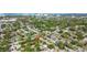 Residential community with mature trees and well-maintained lawns, located near a bustling city at 1411 Barry St, Clearwater, FL 33756