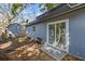 Backyard with sliding glass door leading inside the home at 1411 Barry St, Clearwater, FL 33756