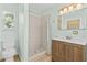 Renovated bathroom with tiled shower and modern vanity at 1411 Barry St, Clearwater, FL 33756