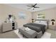 Bedroom with a ceiling fan, two windows and carpet flooring at 1411 Barry St, Clearwater, FL 33756