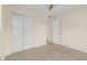 Empty bedroom with a ceiling fan, closet and carpet flooring at 1411 Barry St, Clearwater, FL 33756