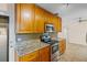 Stylish kitchen with granite countertops and stainless steel appliances at 1411 Barry St, Clearwater, FL 33756