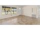 Bright living room featuring tile floors and large windows for natural light at 1411 Barry St, Clearwater, FL 33756