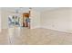Open living area with tile floors and view of kitchen and dining area at 1411 Barry St, Clearwater, FL 33756