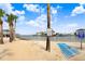 Beach access with beach mat for easy access and stunning waterfront views and houses in the background at 14616 Coral Dr, Hudson, FL 34667