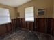 Bedroom needing renovation with exposed walls and original wood flooring, awaiting restoration at 14616 Coral Dr, Hudson, FL 34667