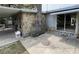 Spacious outdoor patio featuring stone accents, a rock chimney, and a covered area, perfect for entertaining at 14616 Coral Dr, Hudson, FL 34667