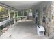 Covered patio with stone accents, overlooking a peaceful canal, and offering a unique outdoor space at 14616 Coral Dr, Hudson, FL 34667