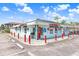 Quaint corner ice cream store with cute details and ample parking on a bright, sunny day at 14616 Coral Dr, Hudson, FL 34667
