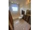 Bathroom featuring toilet, bathtub, window, and exposed framework; awaiting renovation at 1850 Oklahoma Ne Ave, St Petersburg, FL 33703