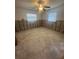 Spacious bedroom awaiting renovation with natural light and a ceiling fan at 1850 Oklahoma Ne Ave, St Petersburg, FL 33703
