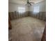 Spacious bedroom awaiting renovation with natural light and a ceiling fan at 1850 Oklahoma Ne Ave, St Petersburg, FL 33703