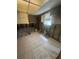 Renovated kitchen with tile floors, window, and exposed framework for customization at 1850 Oklahoma Ne Ave, St Petersburg, FL 33703