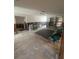 Large living area with ceiling fan and partially finished walls ready for renovation at 1850 Oklahoma Ne Ave, St Petersburg, FL 33703