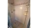 Shower in partially renovated bathroom, showcasing potential for modern upgrades at 1850 Oklahoma Ne Ave, St Petersburg, FL 33703