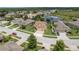 Stunning aerial view of the home nestled in a vibrant community with lush landscaping and scenic surroundings at 19123 Sunset Bay Dr, Land O Lakes, FL 34638